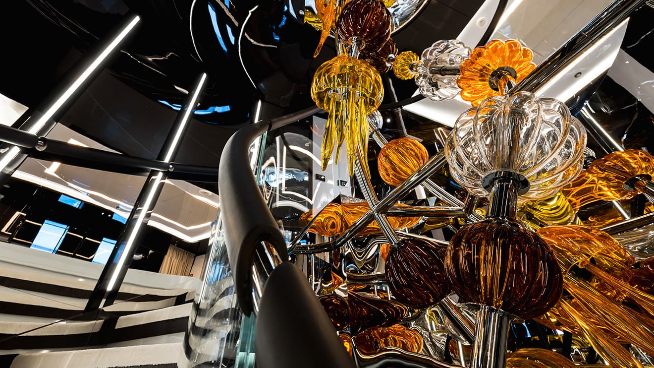 Luxury chandelier in a private yacht, highlighting the opulence in superyacht refit and design.