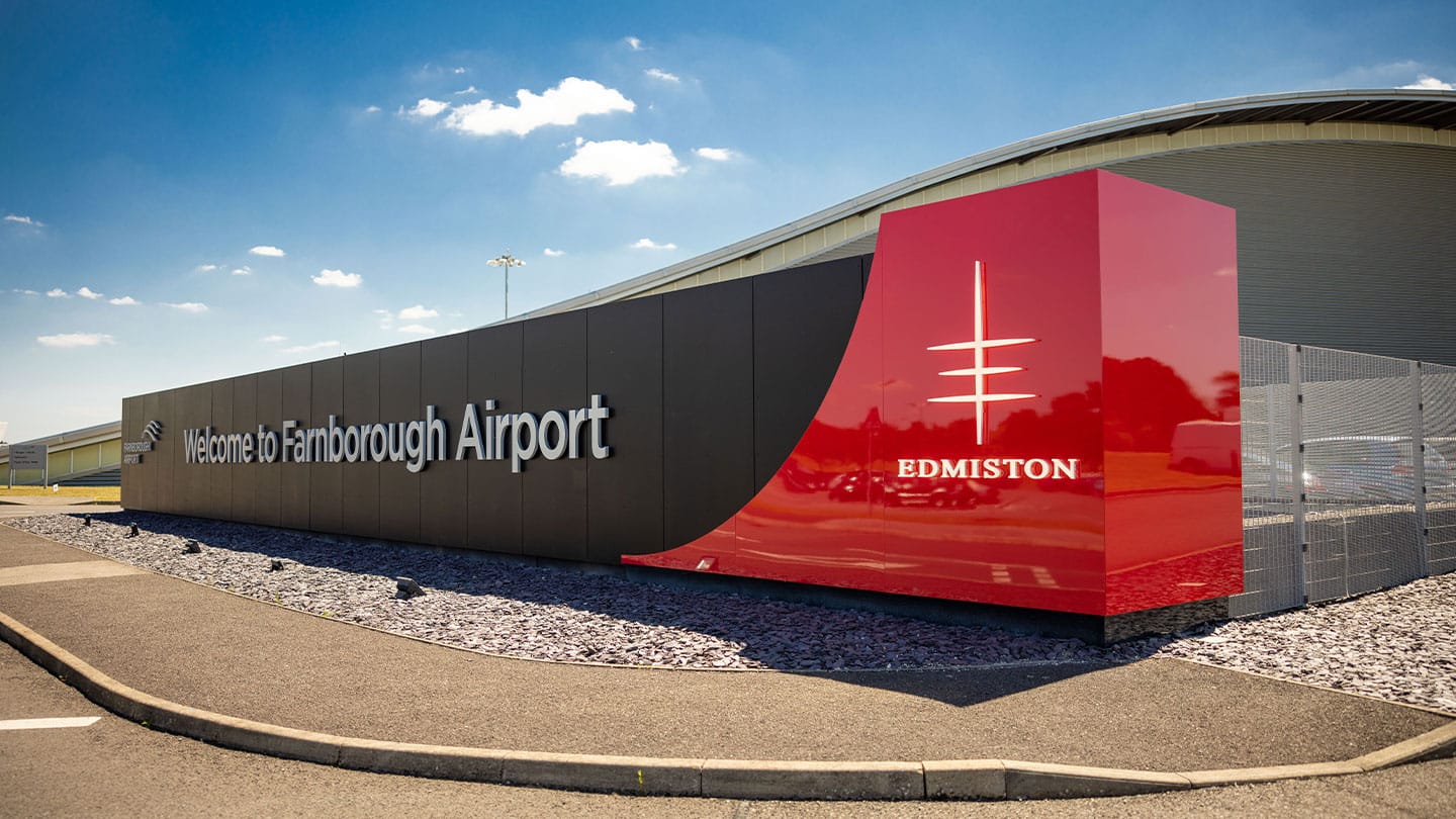 Edmiston logo displayed at Farnborough Airport, showcasing top superyacht brokers and exclusive yacht services.