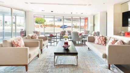 Lounge at the London Heliport Battersea with luxury seating and decor, offering comfort and style for private travelers.