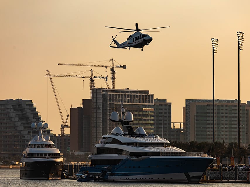 Edmiston Luxury yacht rentals, Abu Dhabi, arriving at the Marina, ready for an unforgettable VIP F1 experience at the Abu Dhabi Grand Prix 2024.