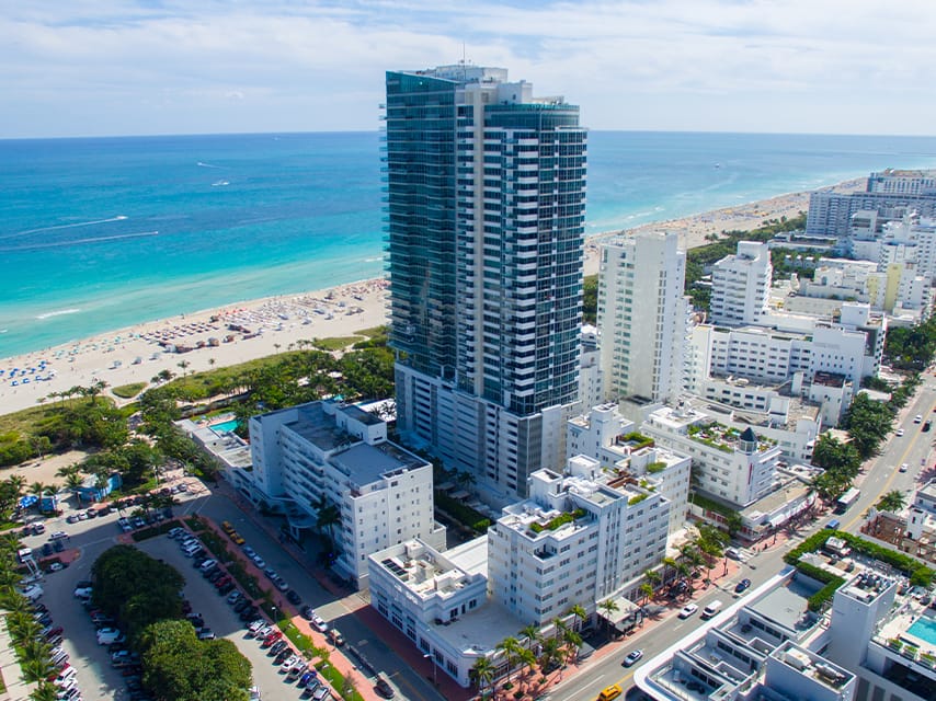 Aerial view of the coastline and hotels, highlighting vibrant Art Basel Art shows to visit during Miami Art Week 2024.