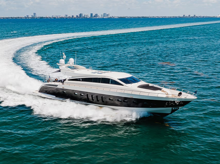Edmiston’s motor yacht Venture, one of our luxury yachts for sale, Miami bound, showing off its impressive speed on the water.