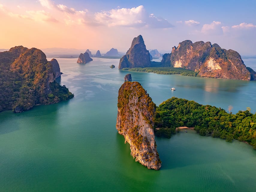 Discover endless scenic islands on a luxury yacht charter in Thailand, a private, peaceful getaway in paradise.