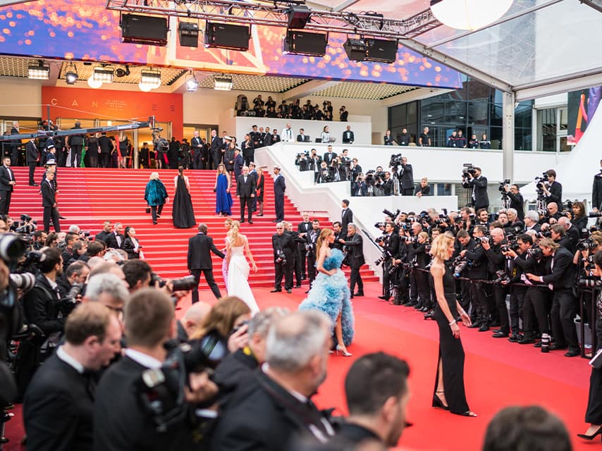 Celebrities pose for paparazzi along the red carper of the Cannes Film Festival, one of the must-attend luxury events, 2025.