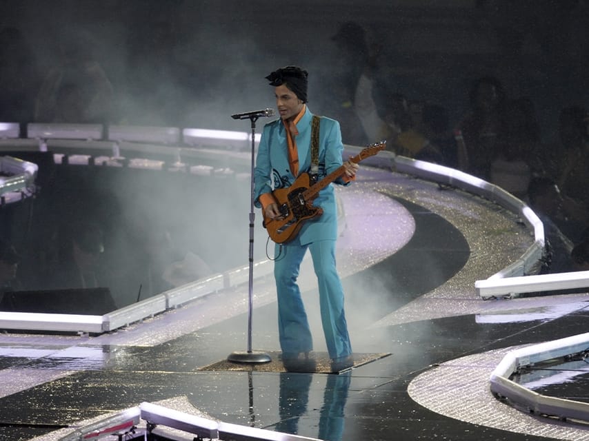 Prince performs at a Superbowl halftime show - Enjoy this key luxury events calendar show from a New Orleans yacht charter.