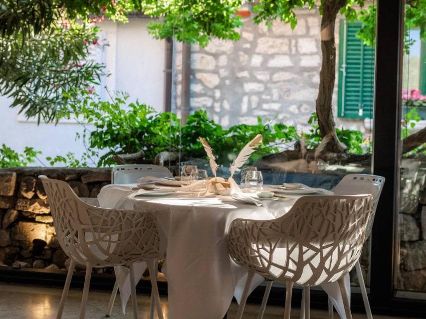 Monte, set in a stonewalled courtyard, ranks among Europe’s top restaurants, ideal for a luxury yacht charter experience.