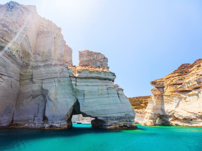 Kleftiko’s unique white cliffs and sea caves in Milos, a surreal stop on any Greek Cyclades island hopping yacht adventure.