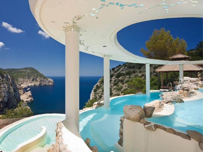 Relax in the cliffside spa pools of La Posidonia with stunning mountain views during your Balearic yacht charter.