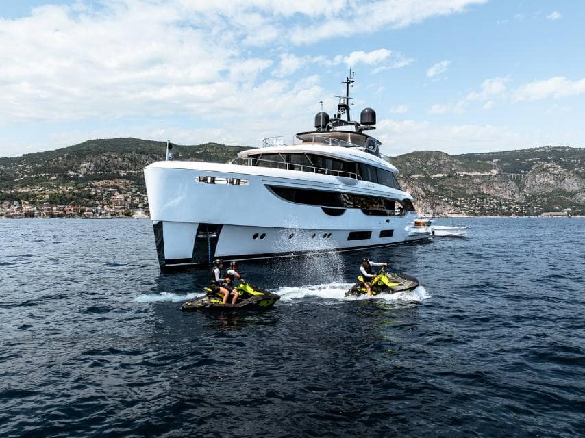 CONTIGO yacht guests ride jet skis, enjoying thrilling yacht watersports in the Mediterranean Sea.