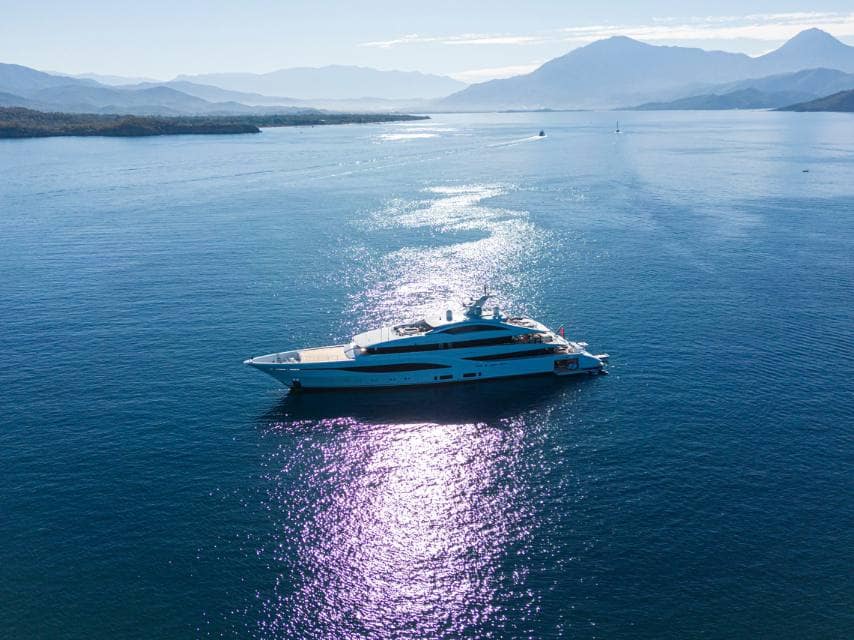 ARROW Yacht glides across the sea, offering breathtaking views on a luxury yacht honeymoon escape.