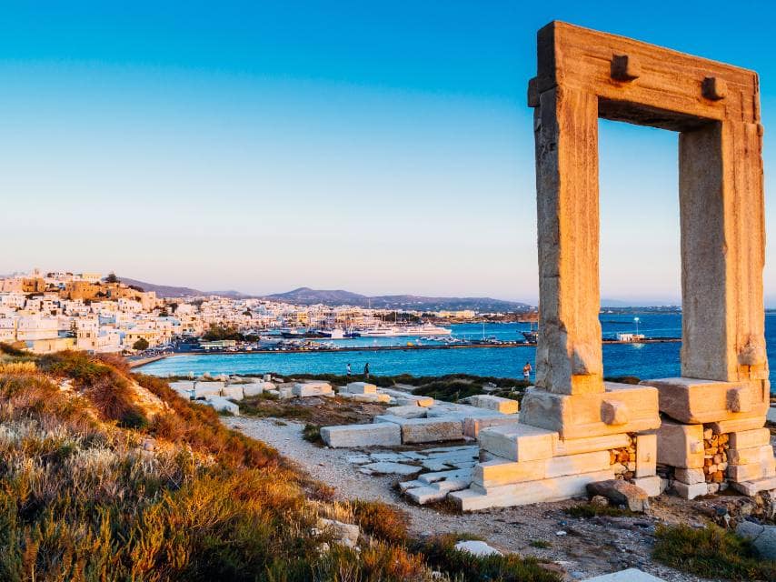 Sunset at Naxos’ Temple of Apollo is one of the best places to visit for Greek mythology yacht charter adventures.