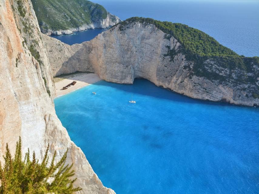 The crystal blue bay, tucked away at Navagio Beach, Zakynthos – a must-see on your mega yacht charter Mediterranean.