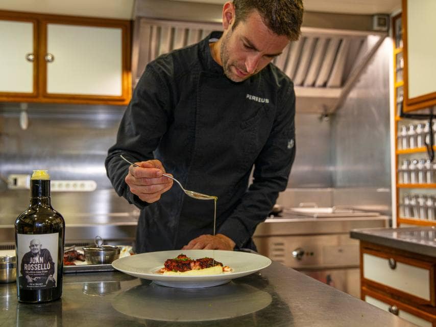 Chef preparing private dinner on yacht charter