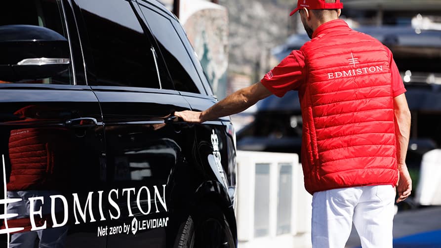 Edmiston staff receive a private car, highlighting luxury services from a superyacht sales company.