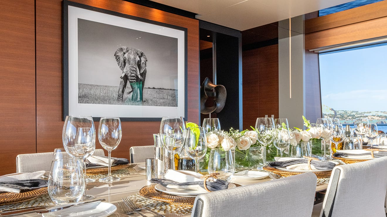 Yacht build owner customizes the new dining room, featuring an elegant table setting.