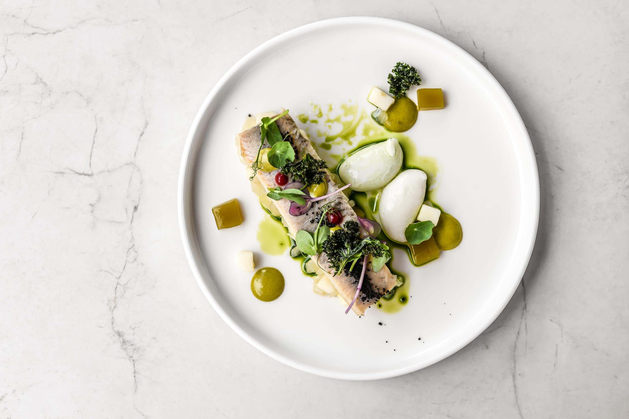 On a Balearics yacht charter, enjoy beautifully presented dishes at Quique Dacosta, a famous restaurant in Europe.