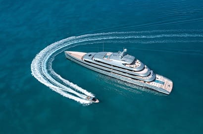 superyacht with tender aerial shot