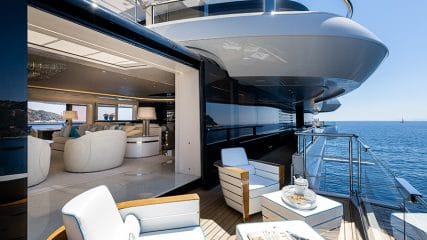 Elegant side deck with seating and custom amenities, highlighting how advantageous it is to build your own yacht.
