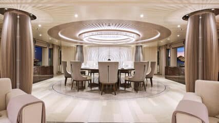 Sophisticated yacht interior with a stylish dining area, designed to showcase a prime way to sell a yacht.
