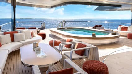 A luxurious yacht deck with sleek seating and a pool, designed to sell your yacht effortlessly.