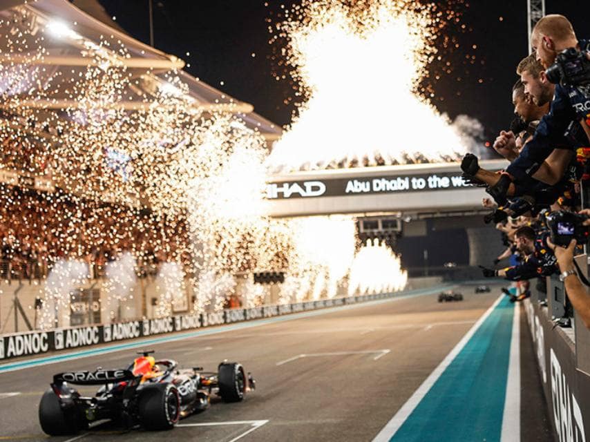 Race team celebrating the final lap, elevating the energy of an Abu Dhabi Grand Prix 2025 yacht charter experience.