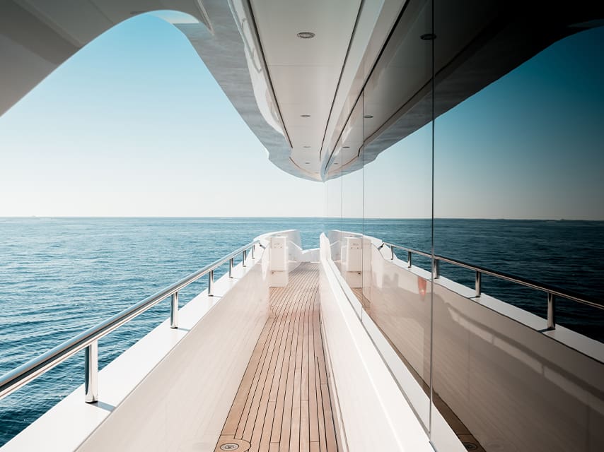 The side deck of a superyacht at sea features innovative and sustainable yacht concepts by leading yacht design companies.