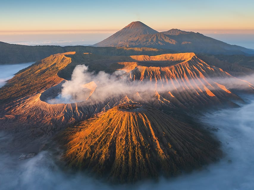For volcano tours, Indonesia's Ring of Fire Region has amazing views from a helicopter on your luxury yacht charter, Indonesia