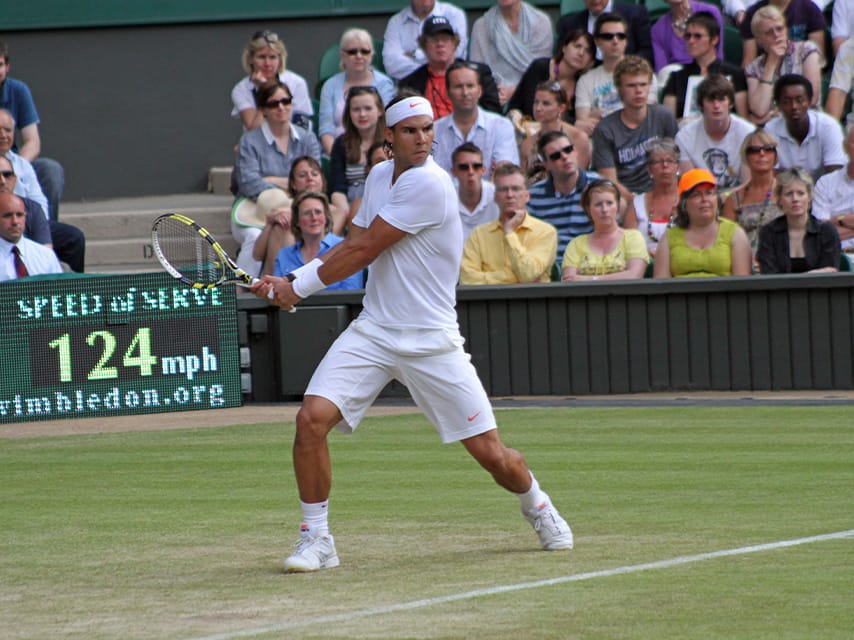 Rafael Nadal in action on the court at Wimbledon, one of the luxury events of 2025. Enjoy a Thames yacht charter for this event.