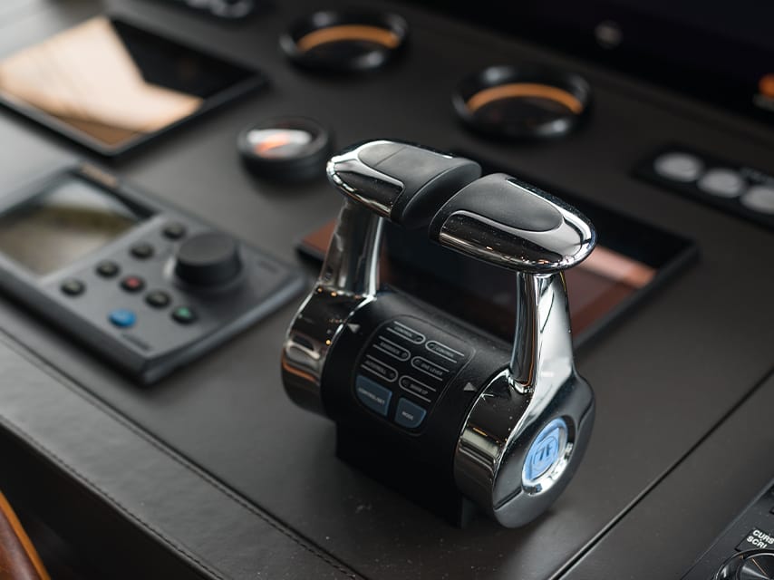 The controls of a superyacht are shown up close. For those booking a superyacht charter, Singapore has many charter options available.