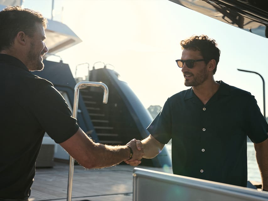 Yacht Owner shaking Captain's hand