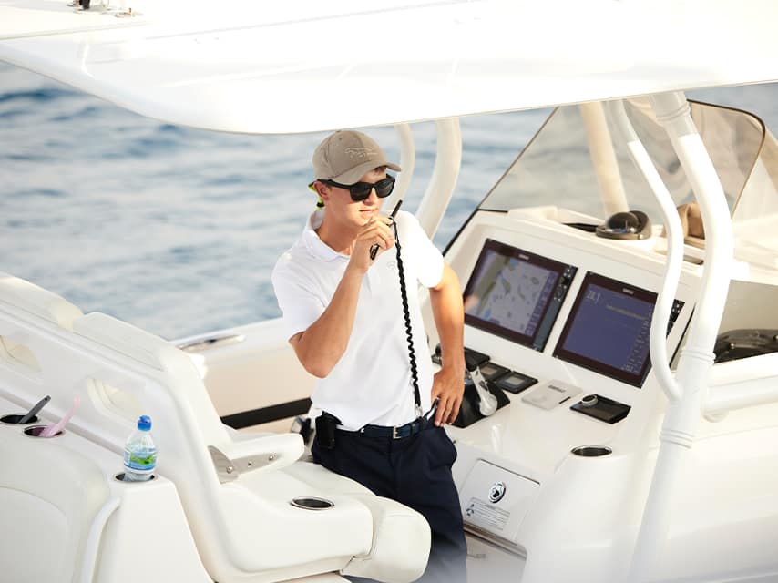 Yacht crew member on a tender