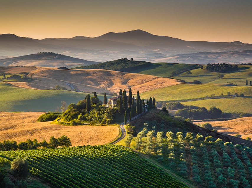 Golden fields and Brunello vineyards await in Val d’Orcia, one of the top 10 UNESCO World Heritage Sites in Italy.
