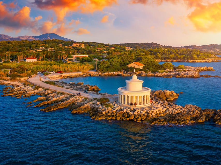 Golden hour over Saint Theodore Lighthouse, enjoyed from a yacht charter, Corfu Greece.