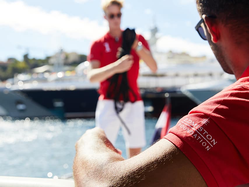 Crew from Edmiston finalizing every detail for a seamless mega yacht charter, Cannes experience.