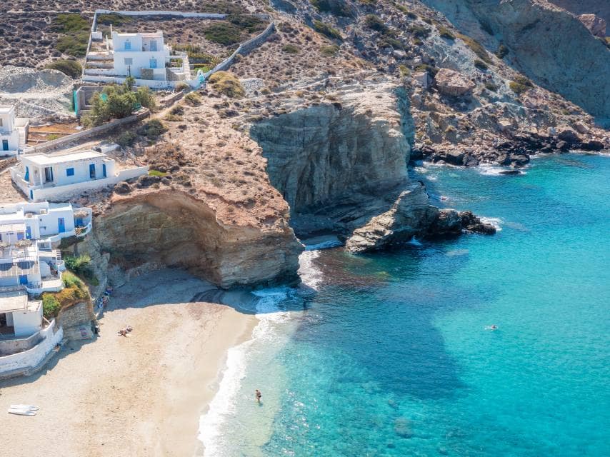 Charming beach cliffs near Naxos discovered during a yacht holidays Greek islands voyage.