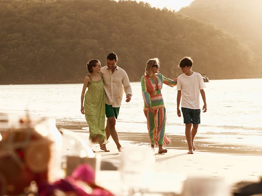 Family beach stroll in the Caribbean