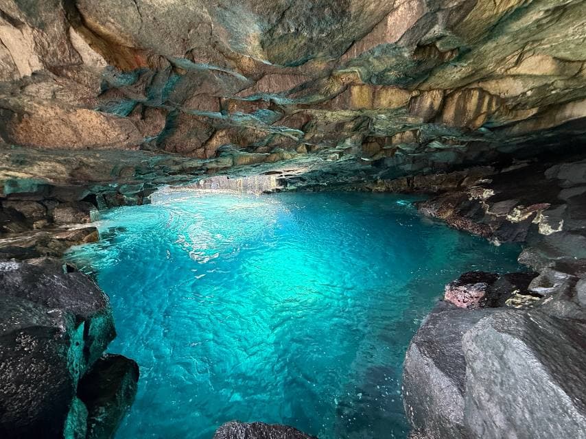 Dramatic underwater cave formations explored during a Tenerife scuba diving trip aboard a charter yacht.