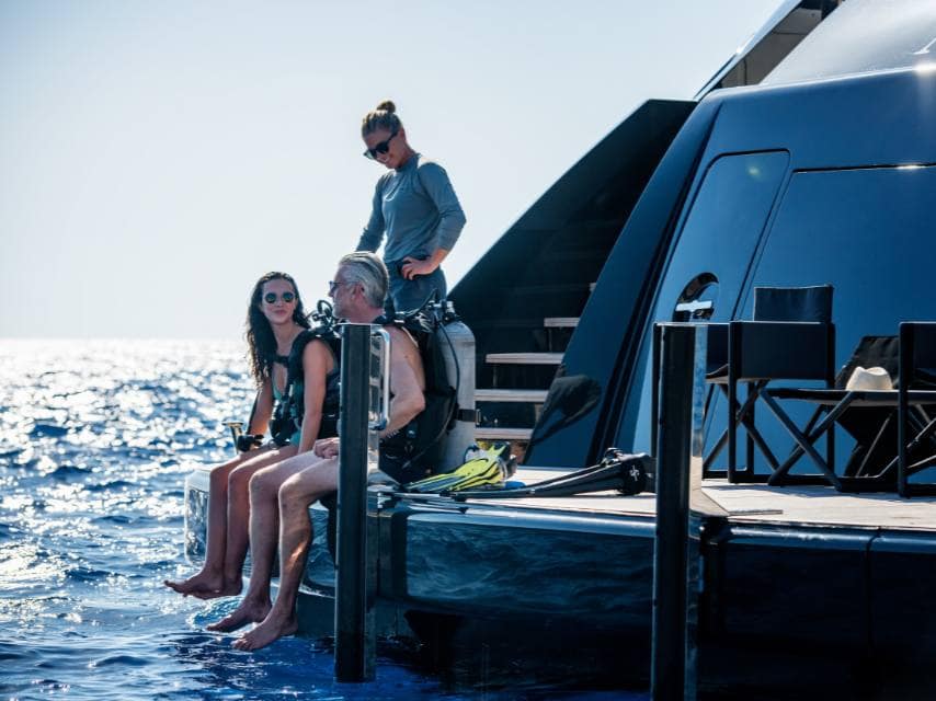 Scuba diving preparations on a Cyprus yacht charter before exploring the famous Zenobia wreck site.