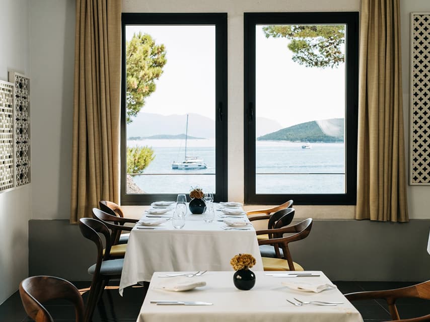 A sea view table at LD Restaurant, a Michelin-starred highlight featuring popular croatian dishes to enjoy on a luxury yacht experience.