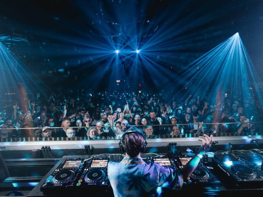 A superstar DJ lights up Pacha, making it one of the best places in Ibiza for a VIP night itinerary.