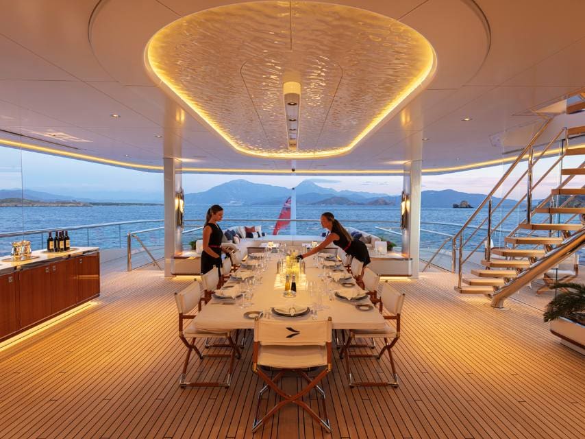 Intimate dinner setup on deck, perfect for unique honeymoons on a private yacht.