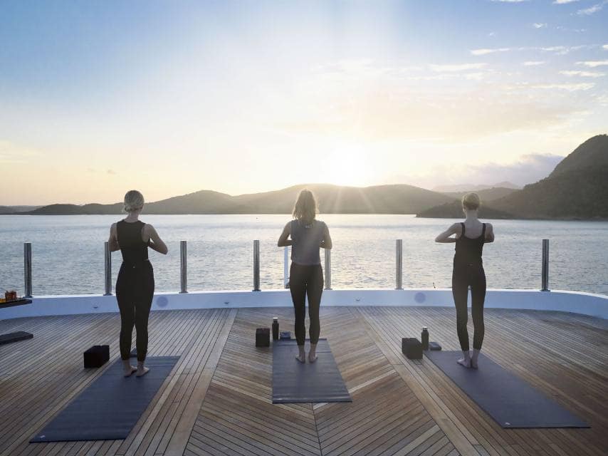 Start your day with yoga on deck, where wellness meets luxury on your Mediterranean superyacht charter.
