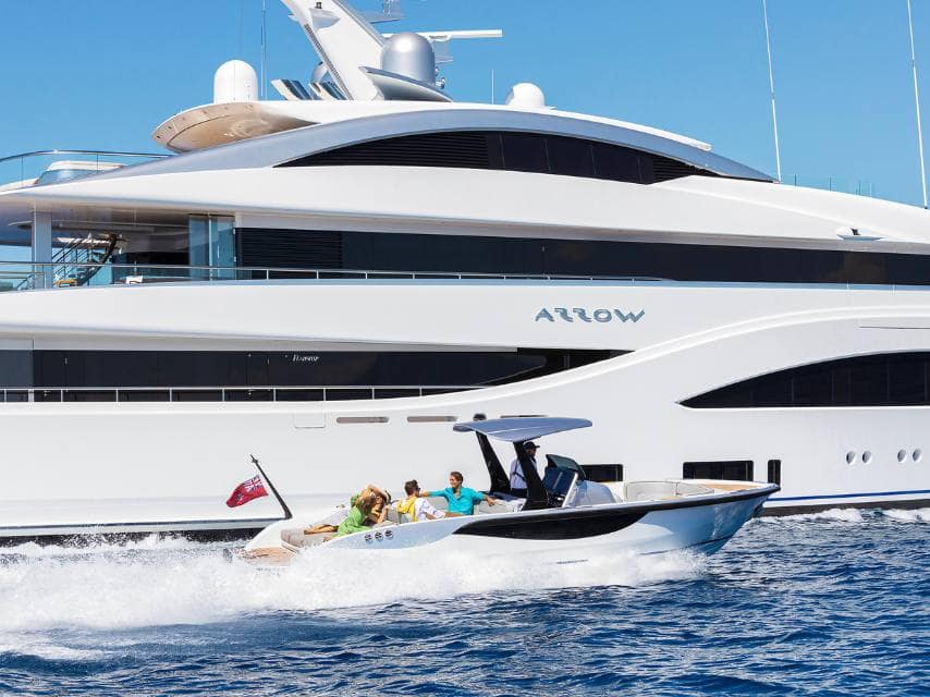 Guests arrive by tender to board Arrow yacht, ready to start their Island of Delos Greek mythology adventure.