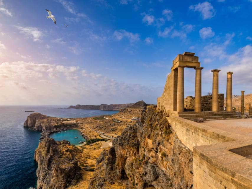 View the Acropolis of Lindos at golden hour, a highlight of your Greek mythology Rhodes yacht adventure.