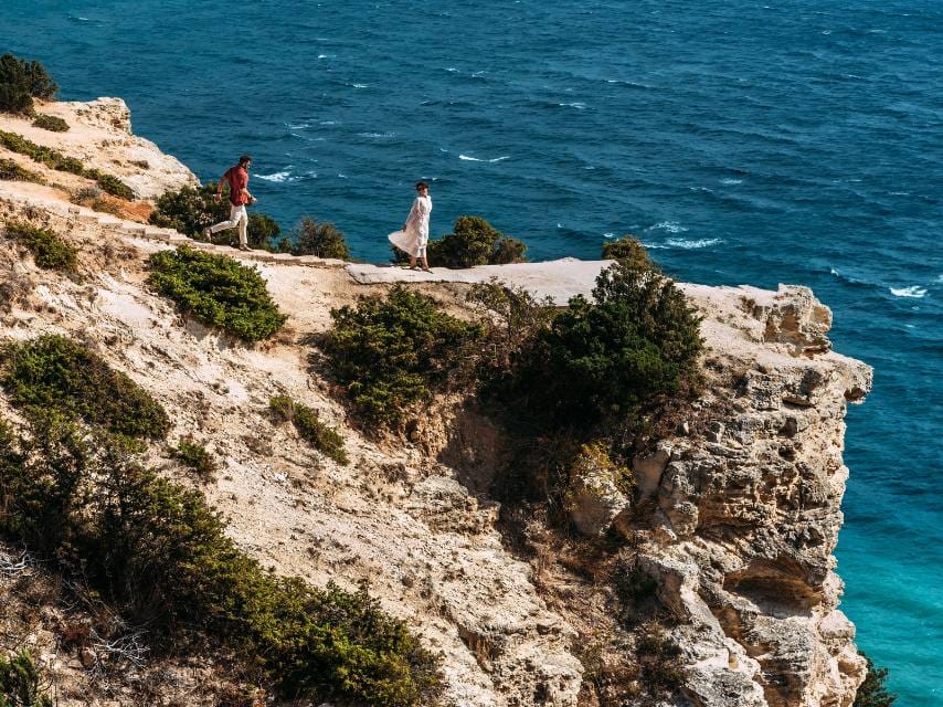 A couple discovers hidden wildlife and cliffs in Greece, best explored via a luxury Mediterranean yacht charter.