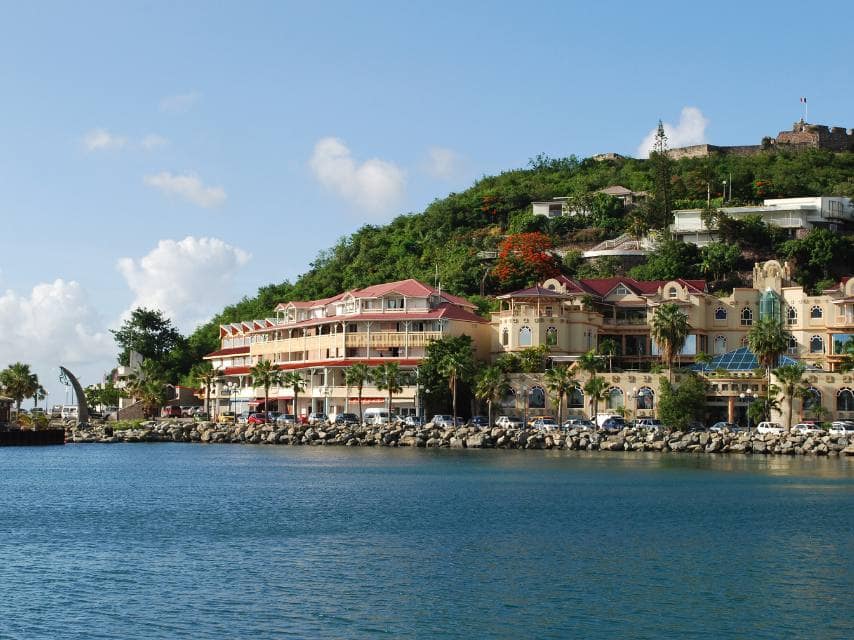 Marigot Bay, perfect for boutique-hopping with stunning shore views on a luxury yacht charter in the Caribbean.