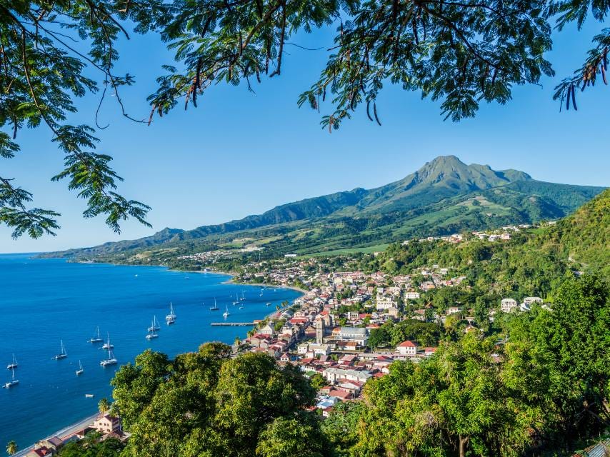 Saint-Pierre village with Mount Pelée in the background, a stunning view on your Martinique yacht charter.