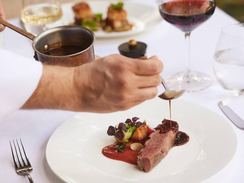 A flawless Tournedos Rossini presentation at Café Boulud, one of Bahamas' top restaurants.