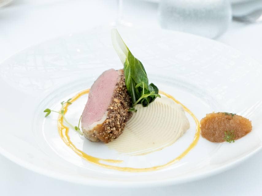 An elegant plate at Rhodes Restaurant, Grenada, showcases the refined island flavours of this luxury, high end Caribbean restaurant.