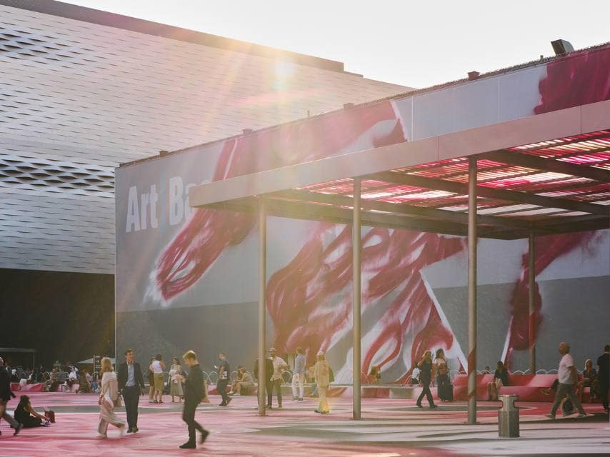 Visitors gather outside the Art Basel museum in Basel, a cornerstone of global luxury events in the Art world.